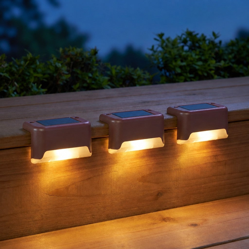 Solar Powered Deck Lights in brown, mounted on a deck rail at dusk