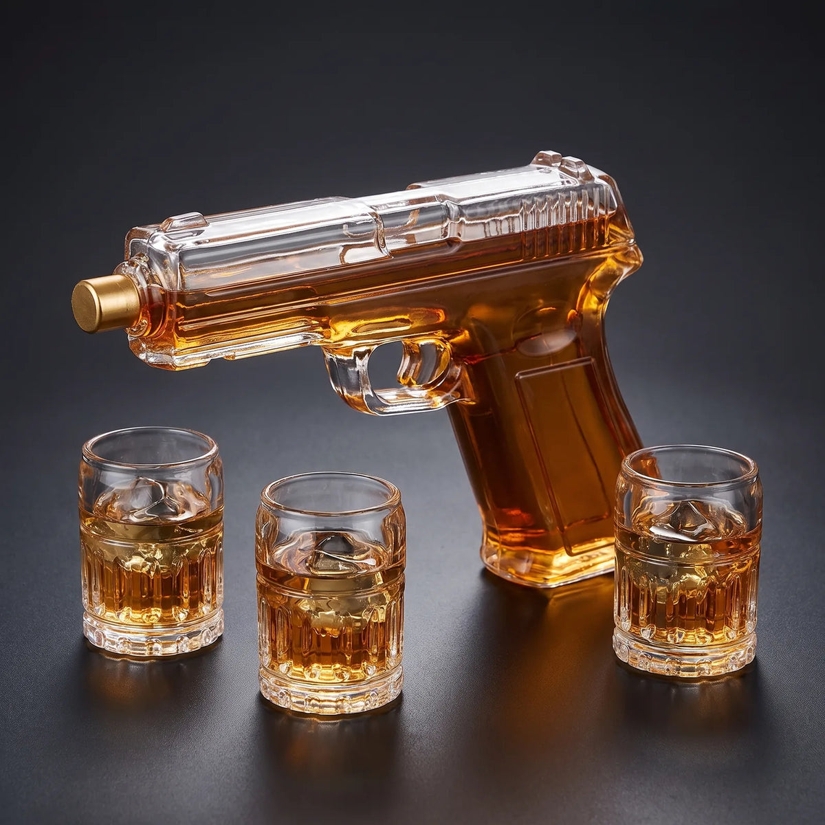 Pistol Decanter with 2 Shot Glasses on a dark studio background