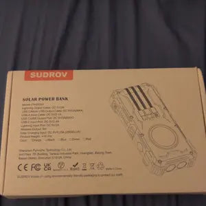 Sudrov 42800 mAh Solar Charger Power Bank Wireless Charger Built in 4 Cables 7 Outputs 15 Watts Fast Charging Power Bank for All Mobile Devices 3 Inputs Solar Portable Charger with Dual Flashlights, Carabiner and Thermometer