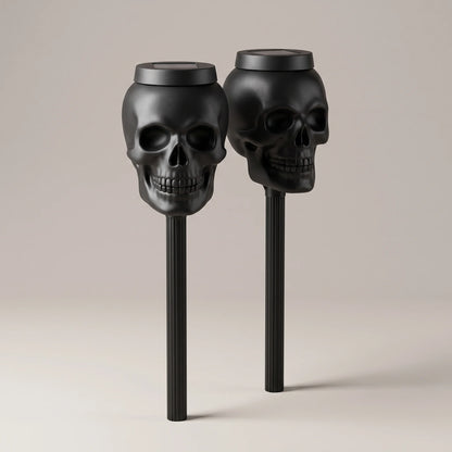 Solyra matte black solar skull torch light on a stake, studio product photo