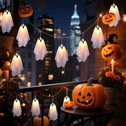 Warm Light hanging fabric ghost string lights glowing on a balcony at night