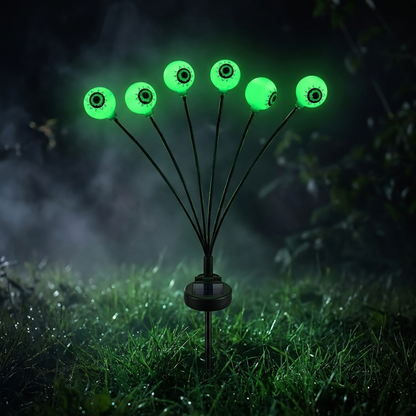 Single solar eyeball light stake, six glowing green eyes