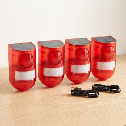 Four solar motion alarms with USB charging cables