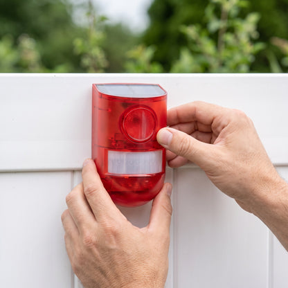 Positioning the solar motion alarm on a fence panel