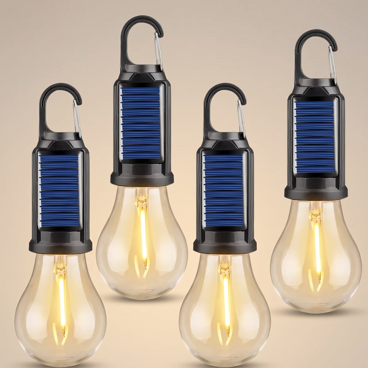 Four solar camping bulb lights in a row on a neutral studio backdrop, filaments glowing