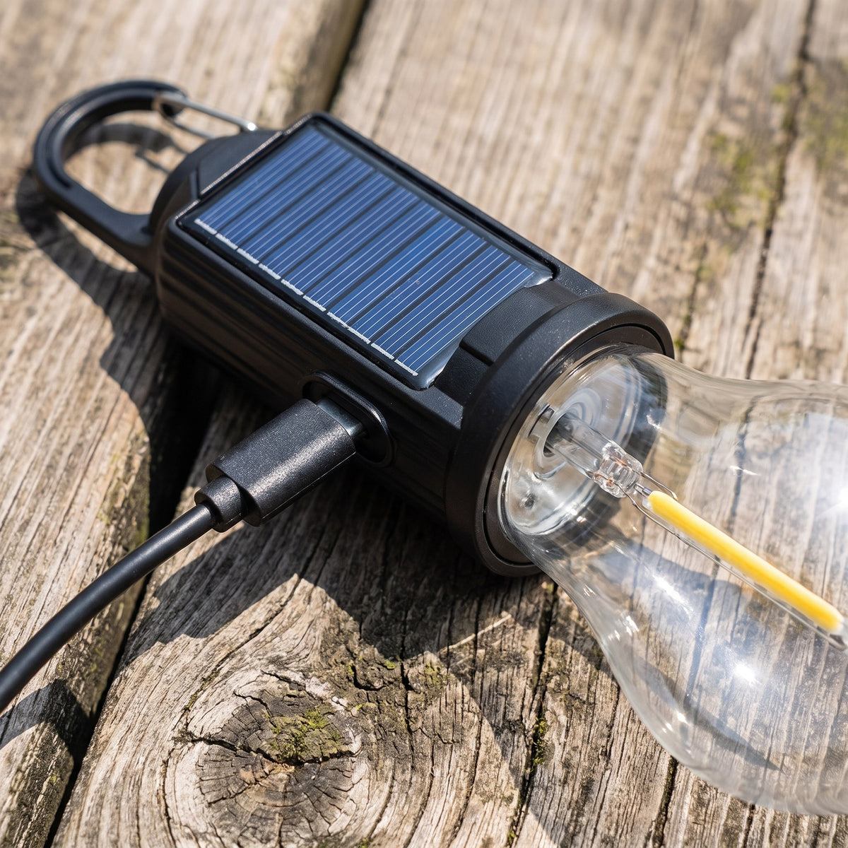 Close-up of the USB-C port and blue solar panel on the black cap of the camping light