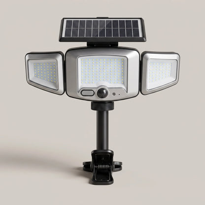 Solar motion sensor flood light with three adjustable LED heads, solar panel and spring clamp mount