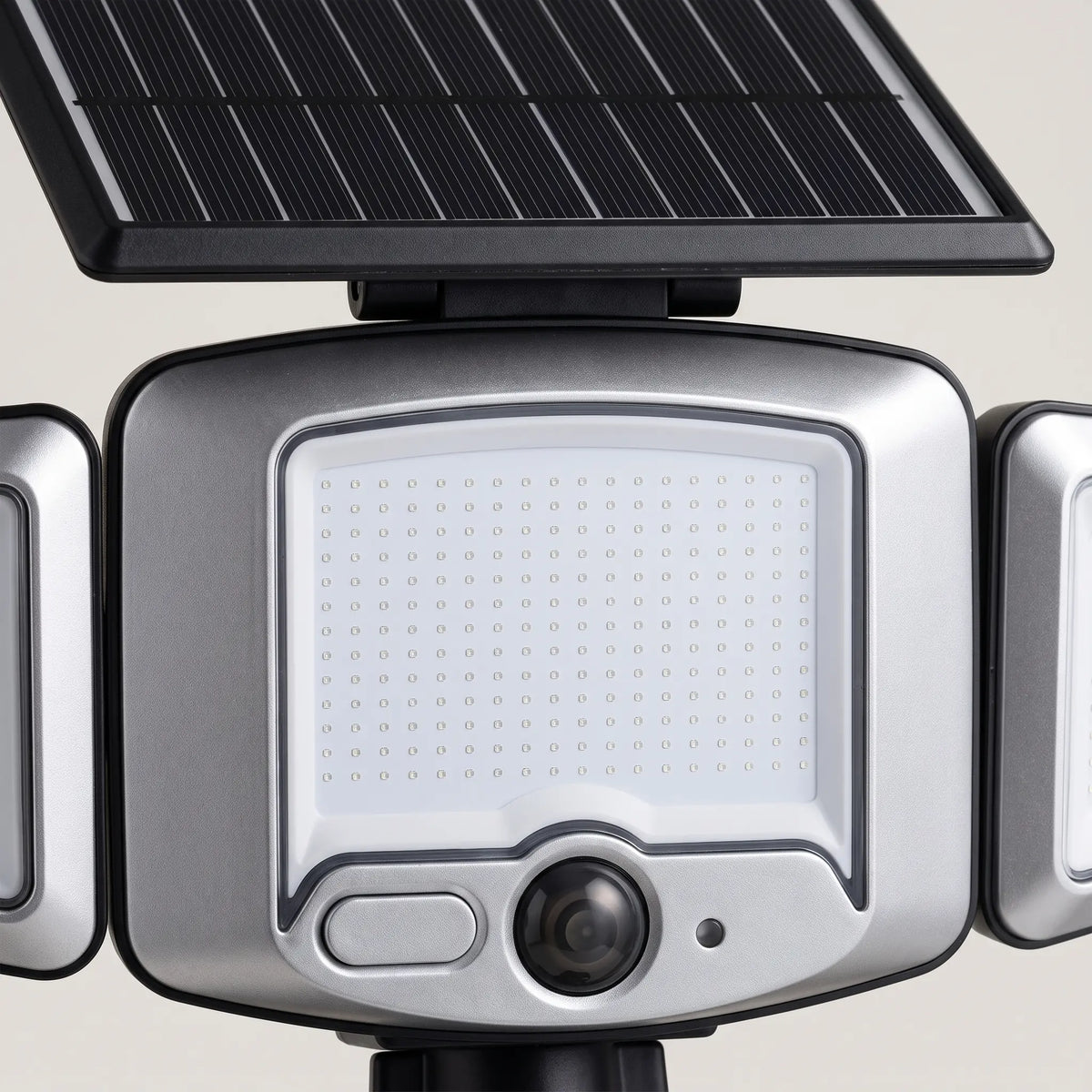 Close-up of the solar panel and the round motion sensor lens