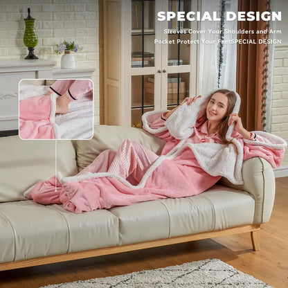 Woman relaxing on the sofa in the wearable heated blanket with sleeves and foot pocket