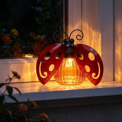 Close-up of the solar ladybug light throwing a patterned glow at night