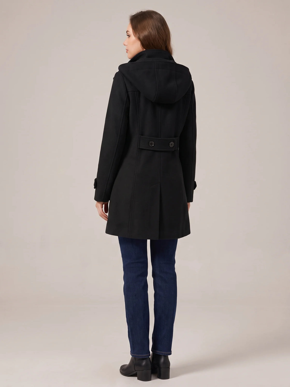 Back of the Black hooded wool pea coat with the hood up, showing the buttoned waist tab and back vent