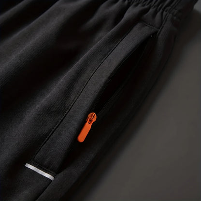 Close-up of the zipper side pocket and drawstring waist on Flex Fit training shorts