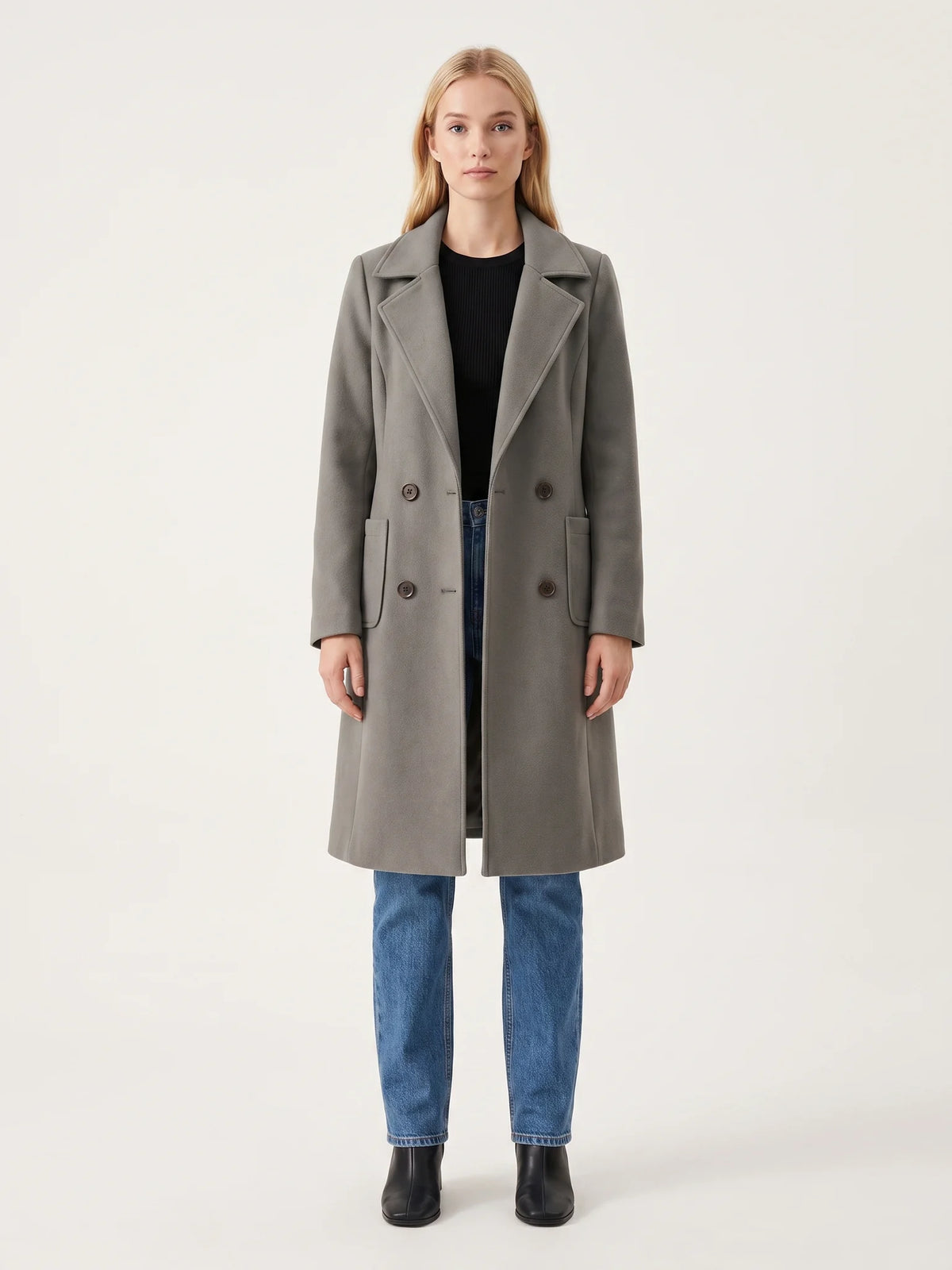 The Grey wool-blend coat worn open on a model, photographed from the front in a studio