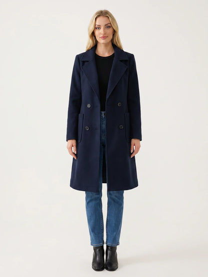 The Navy wool-blend coat worn open on a model, photographed from the front in a studio