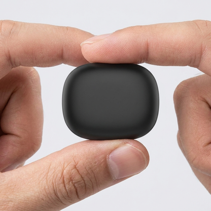 Noxpods charging case held between two fingers showing its compact pocket size