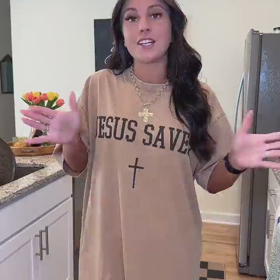 Customer try-on of the Jesus Saves tee in khaki, also showing the washed blue