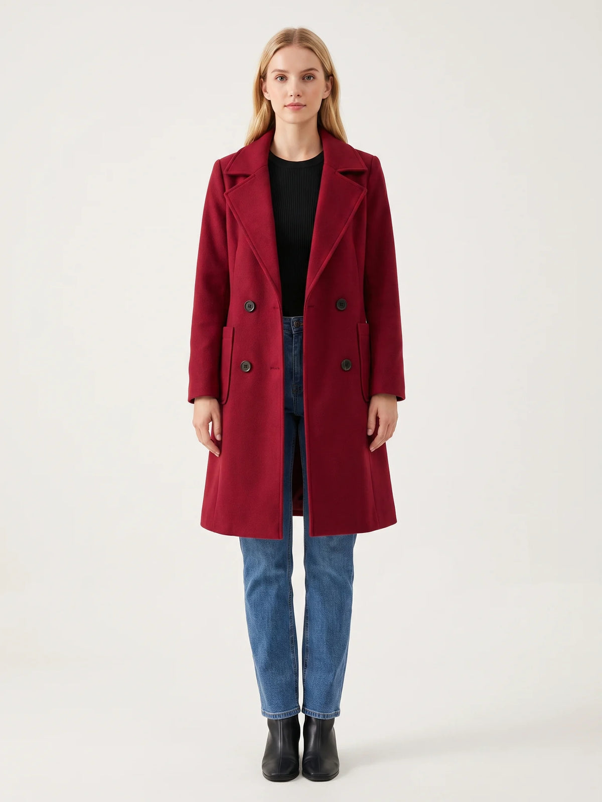 The Crimson wool-blend coat worn open on a model, photographed from the front in a studio