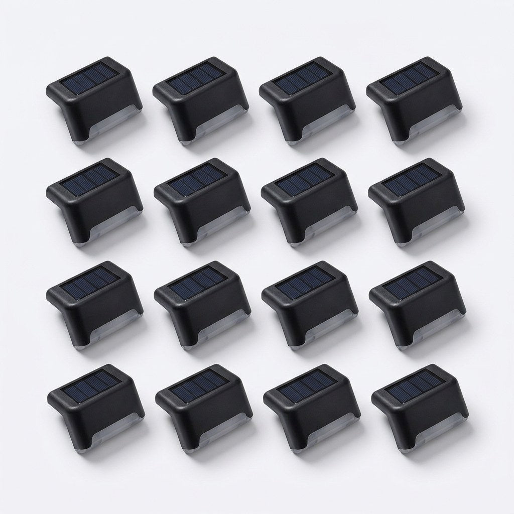 All 16 matte black solar deck lights from the 16 pack laid out on white